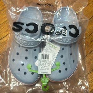 Bayaband crocs in grey with white soles and orange stripe in size 9m / 11w